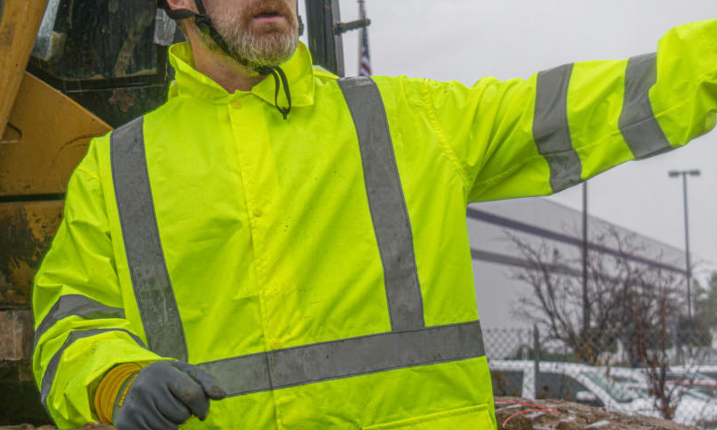 Worker in a hi-vis waterproof rain jacket